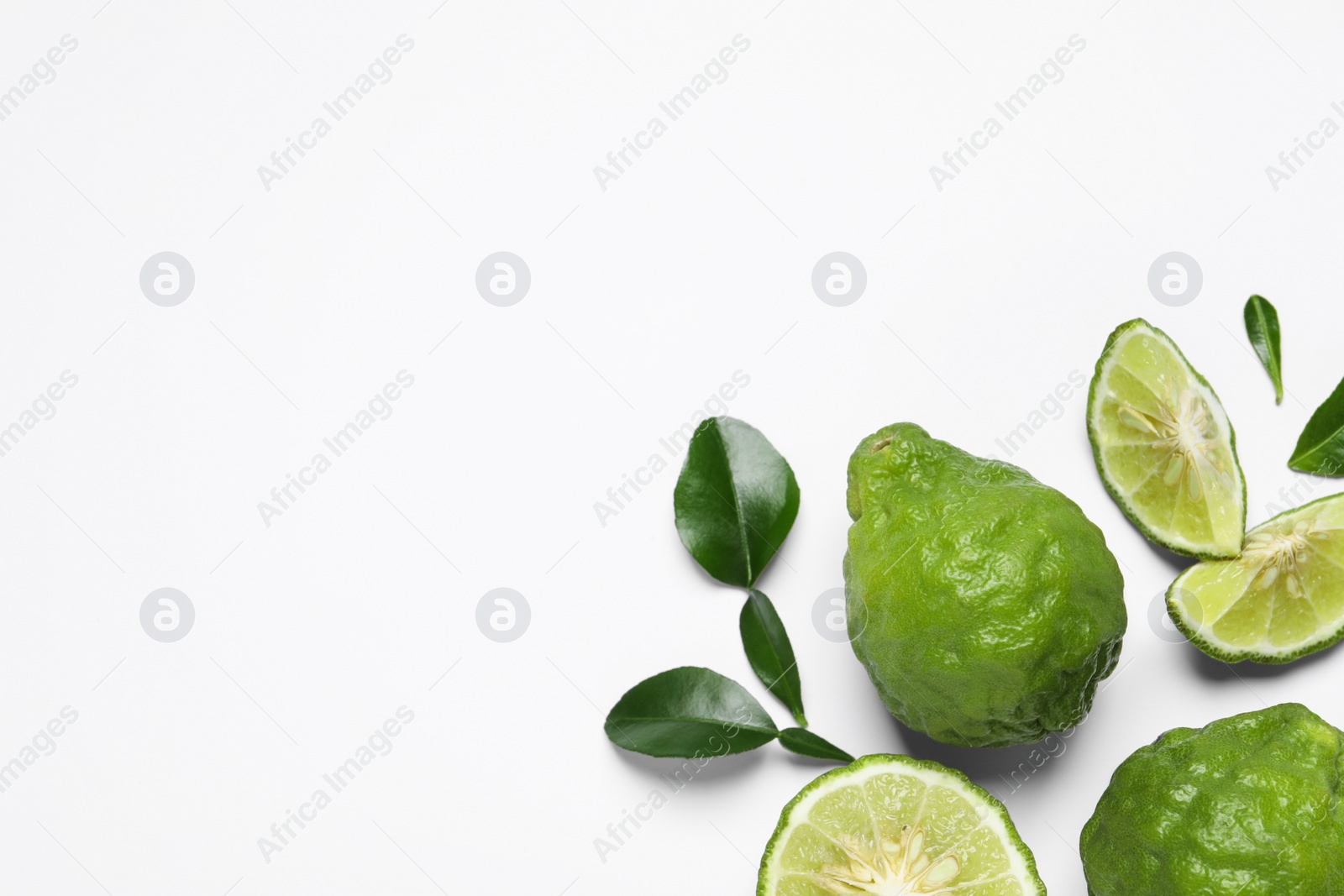 Photo of Flat lay composition with ripe bergamot fruits on white background. Space for text