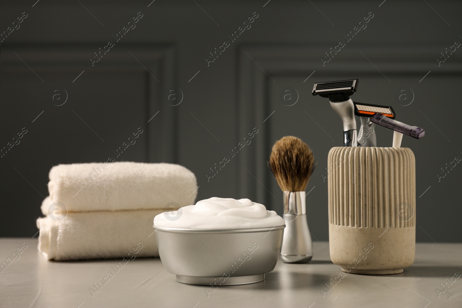 Photo of Set of men's shaving tools on grey table