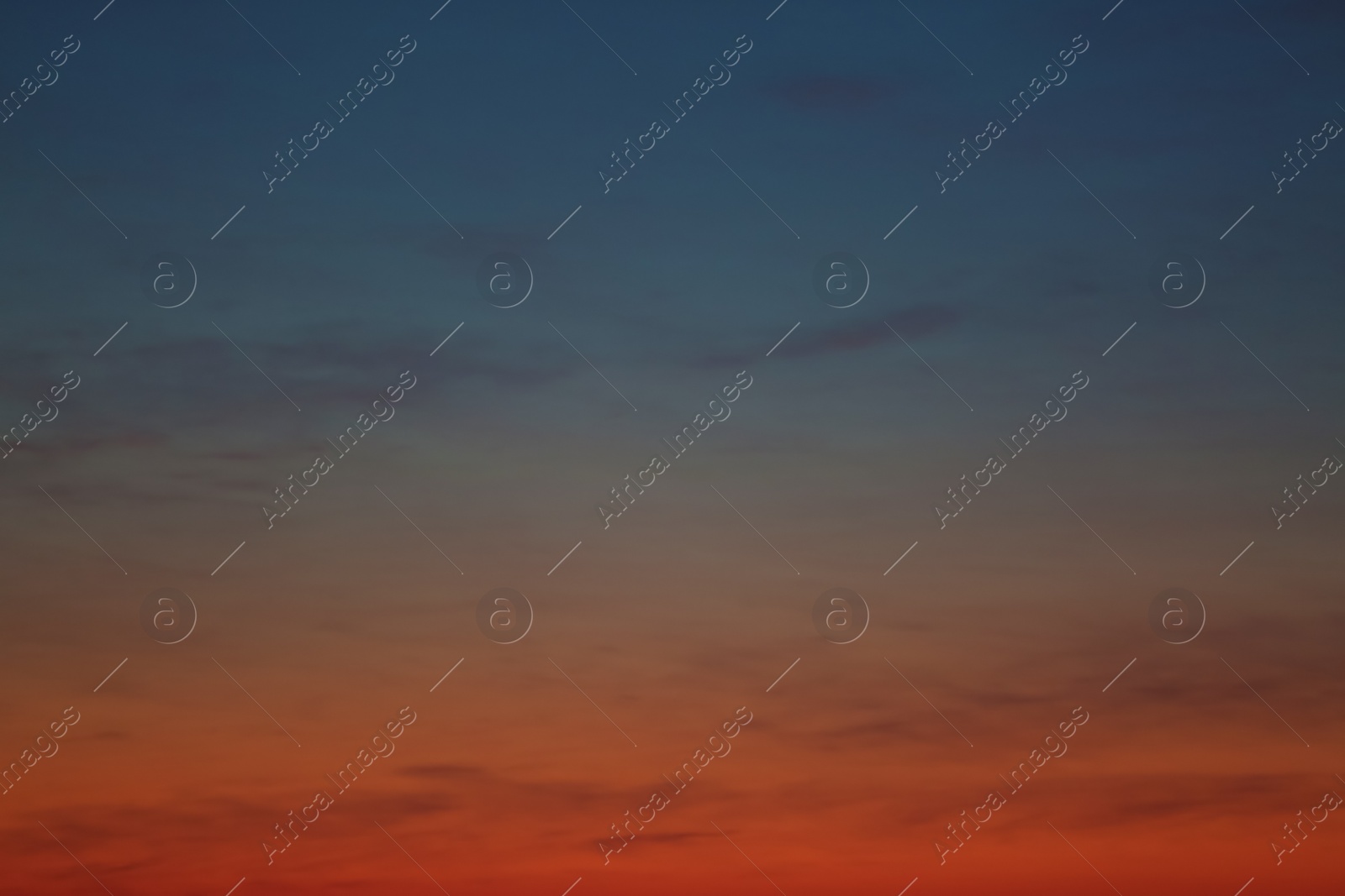 Photo of Picturesque view of beautiful sky lit by setting sun