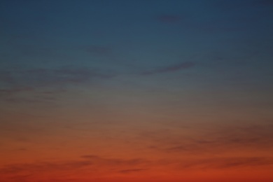 Photo of Picturesque view of beautiful sky lit by setting sun