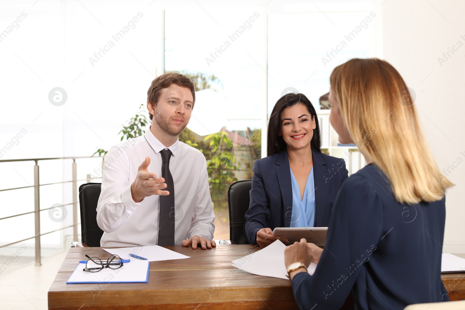 Photo of Human resources commission conducting job interview with applicant in office