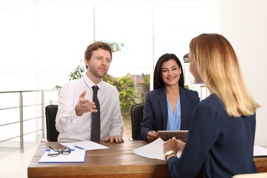 Human resources commission conducting job interview with applicant in office