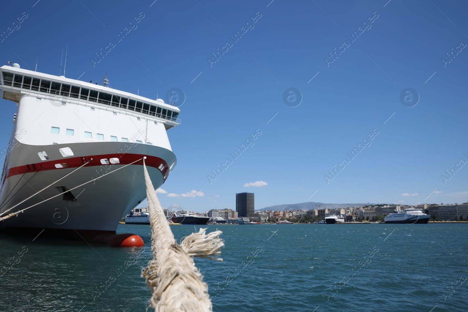Photo of Modern ferry moored in sea port on sunny day