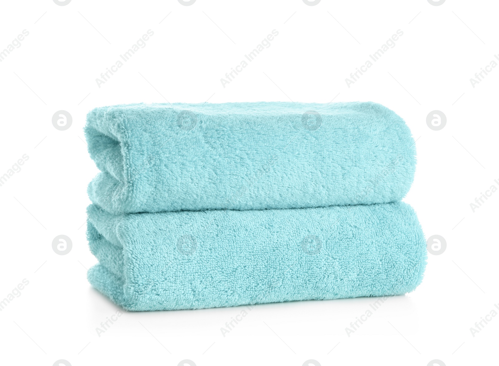 Photo of Stack of clean soft towels on white background