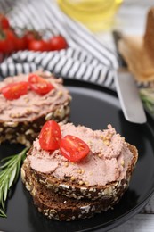 Photo of Delicious liverwurst sandwiches with tomatoes on table, closeup