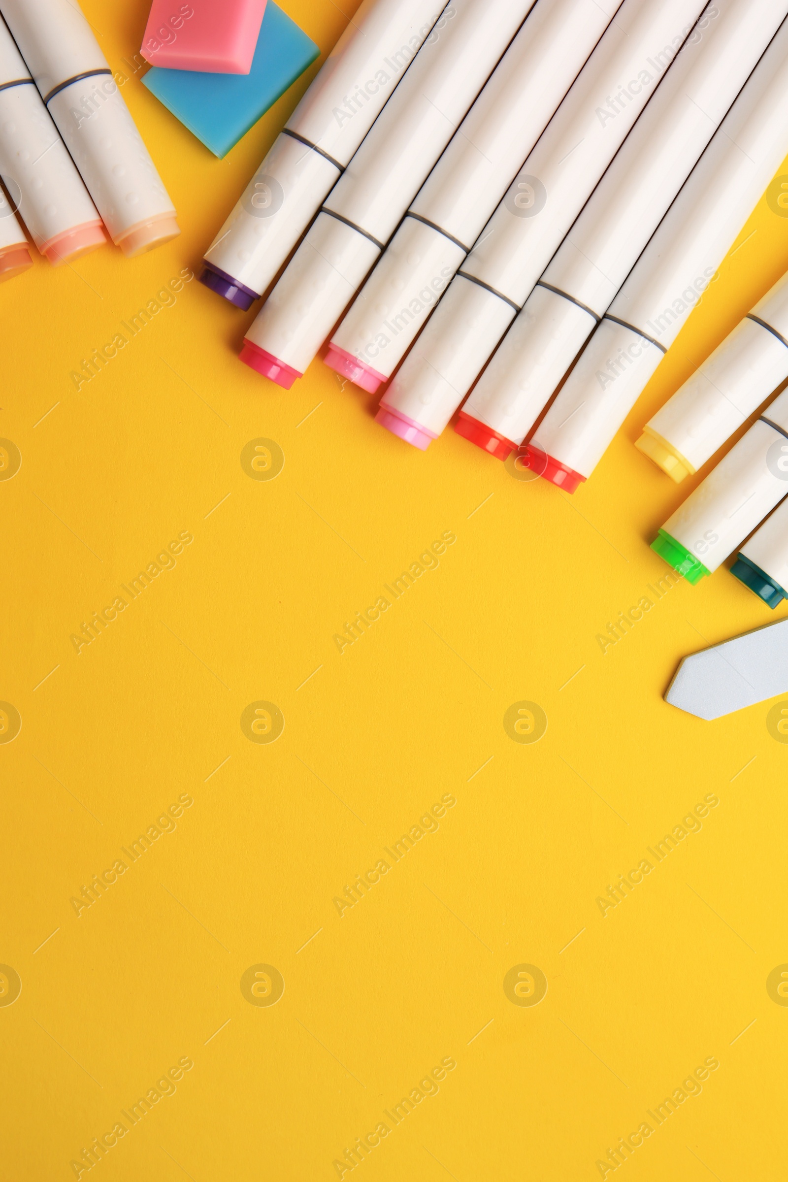 Photo of Different school stationery on yellow background, flat lay with space for text. Back to school