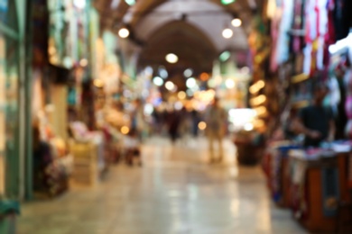 Blurred view of covered passageway with stores