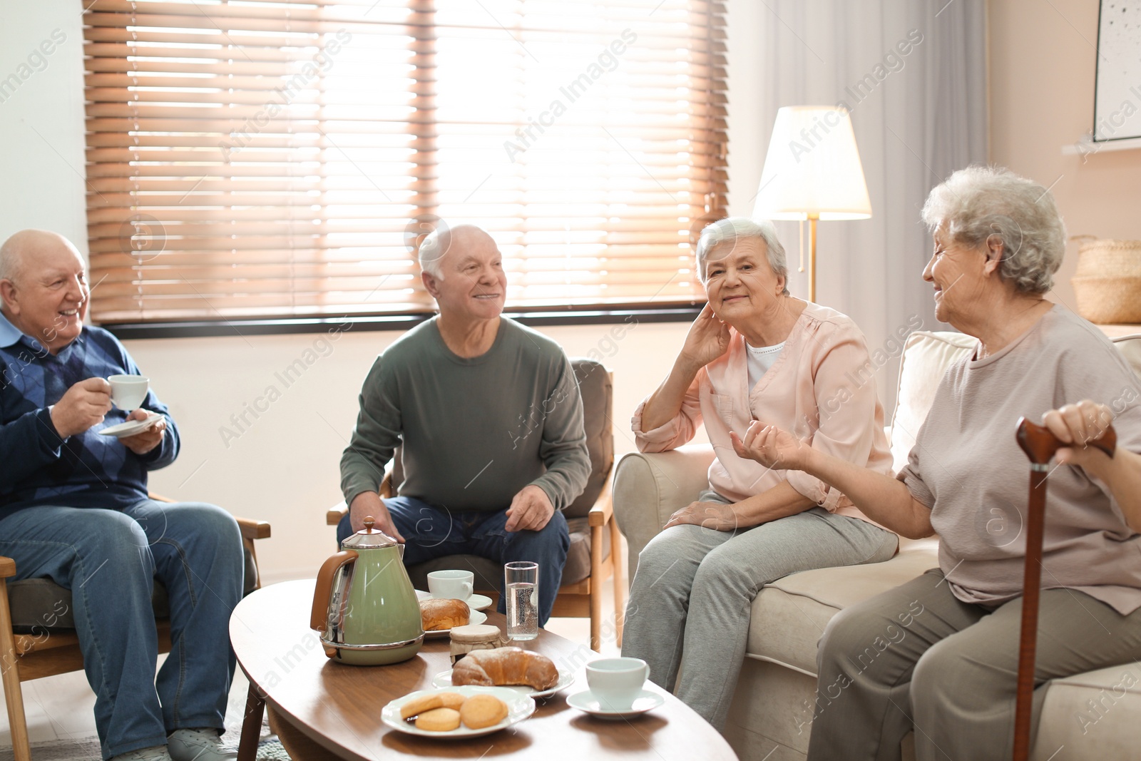 Photo of Elderly people spending time in geriatric hospice. Senior patients care