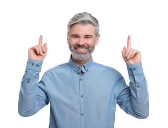 Mature businessman in stylish clothes posing on white background