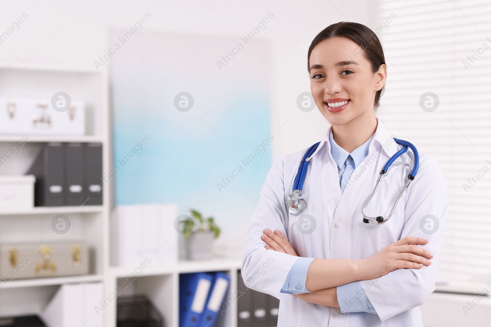 Photo of Medical consultant with stethoscope in clinic, space for text