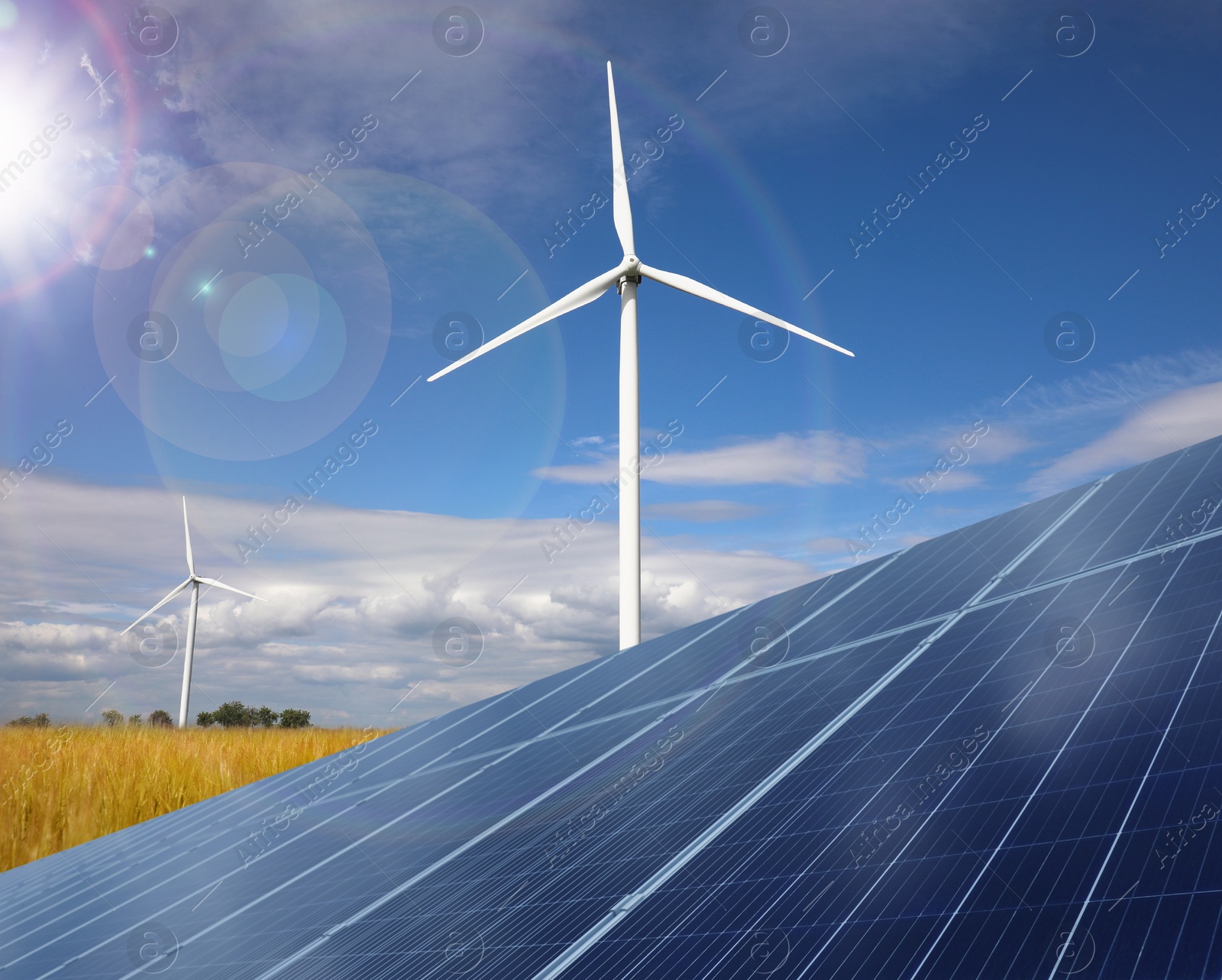 Image of Solar panels and wind turbines installed outdoors. Alternative energy source