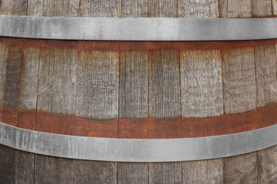 Photo of Traditional wooden barrel as background, closeup. Wine making