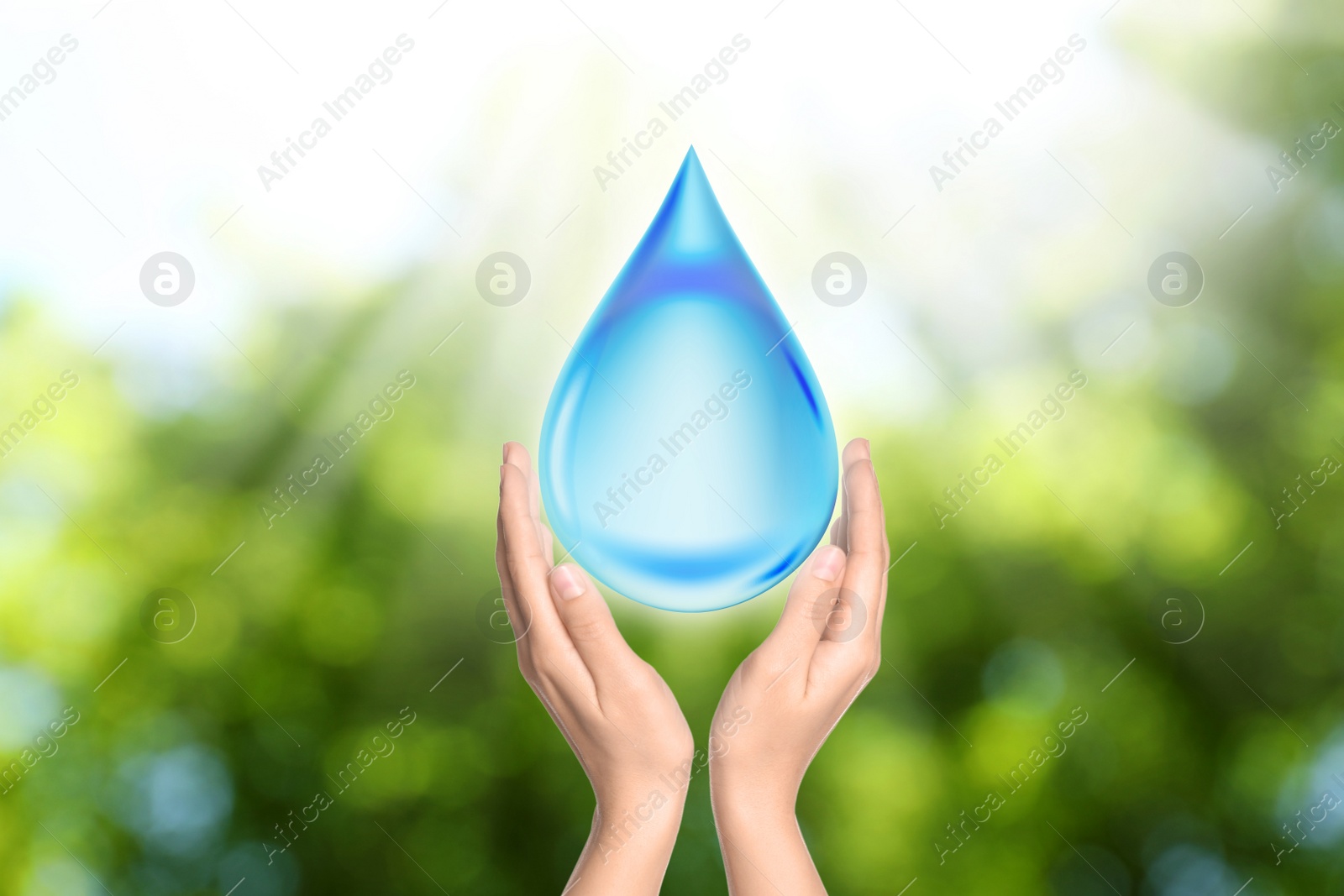 Image of Woman holding icon of water drop on sunny green background, closeup. Ecology concept