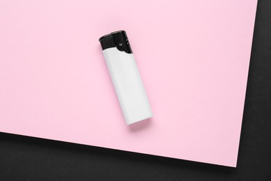 Photo of Stylish small pocket lighter on color background, top view