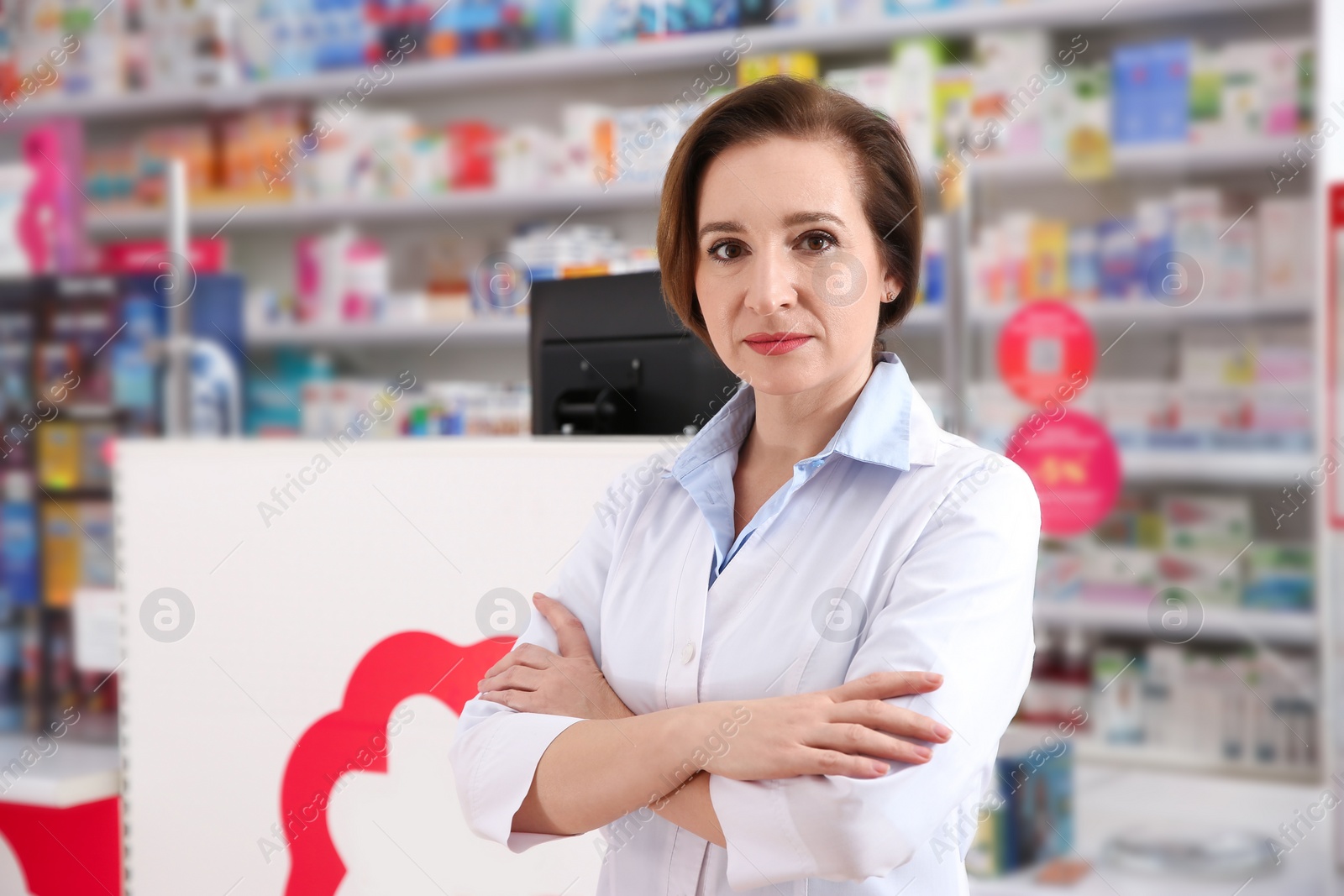 Photo of Portrait of professional pharmacist in modern drugstore