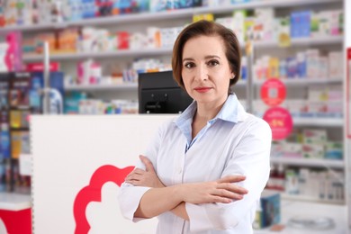 Photo of Portrait of professional pharmacist in modern drugstore
