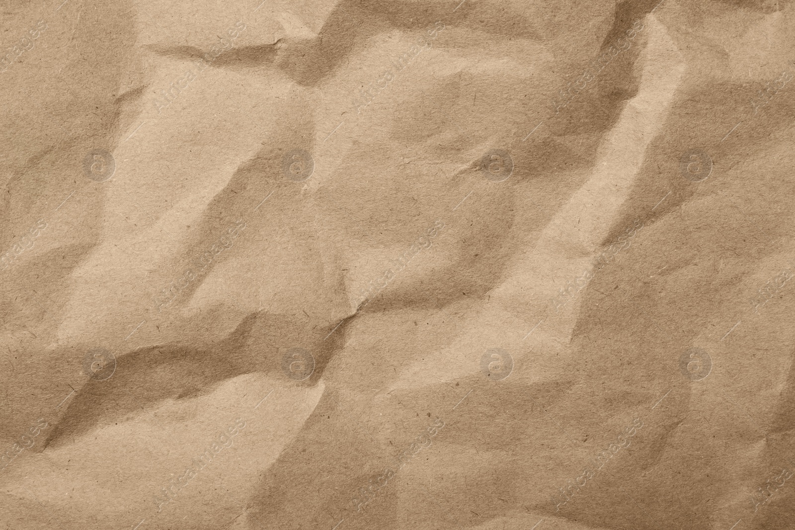 Photo of Brown crumpled paper texture as background, top view