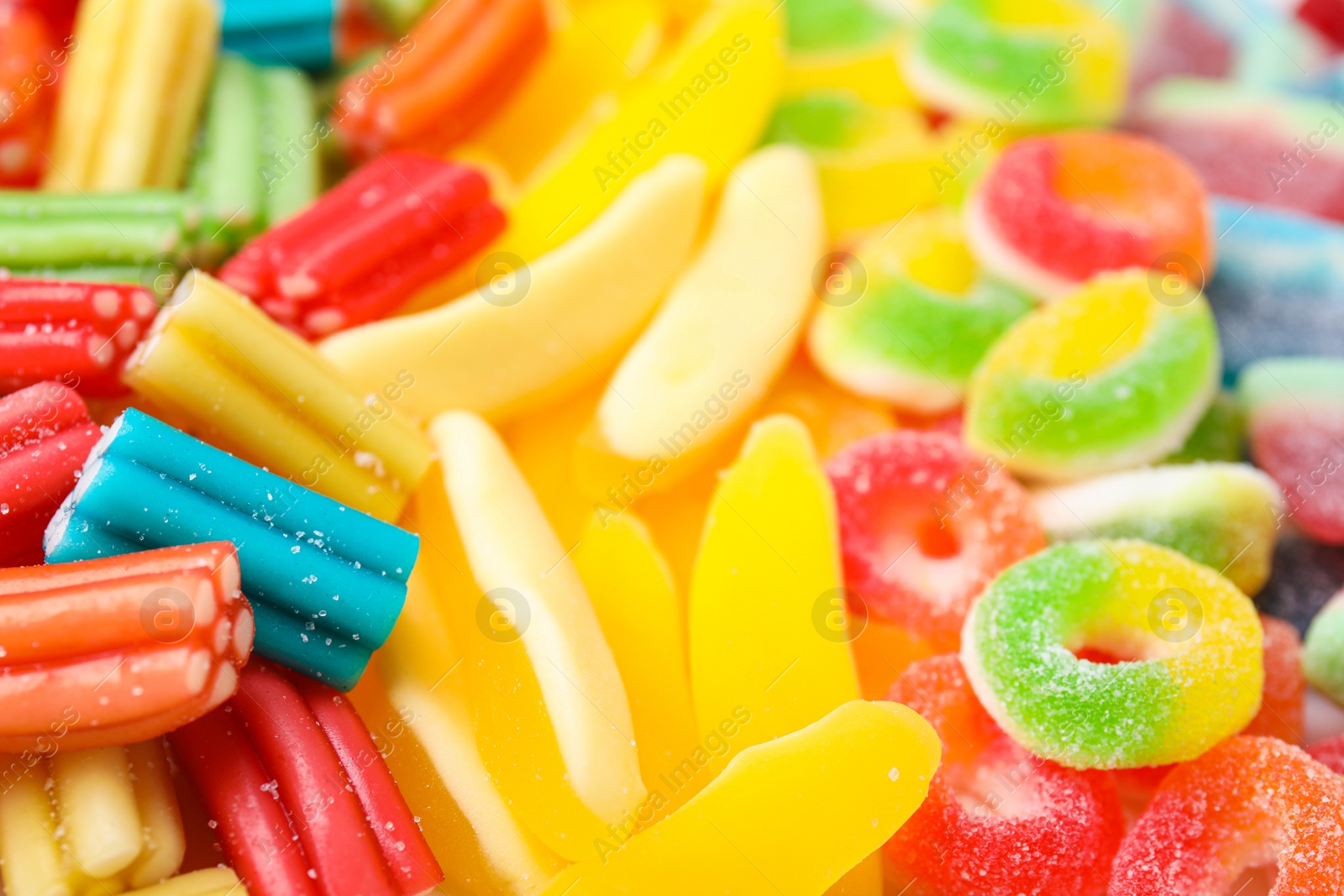 Photo of Tasty colorful jelly candies as background, closeup view