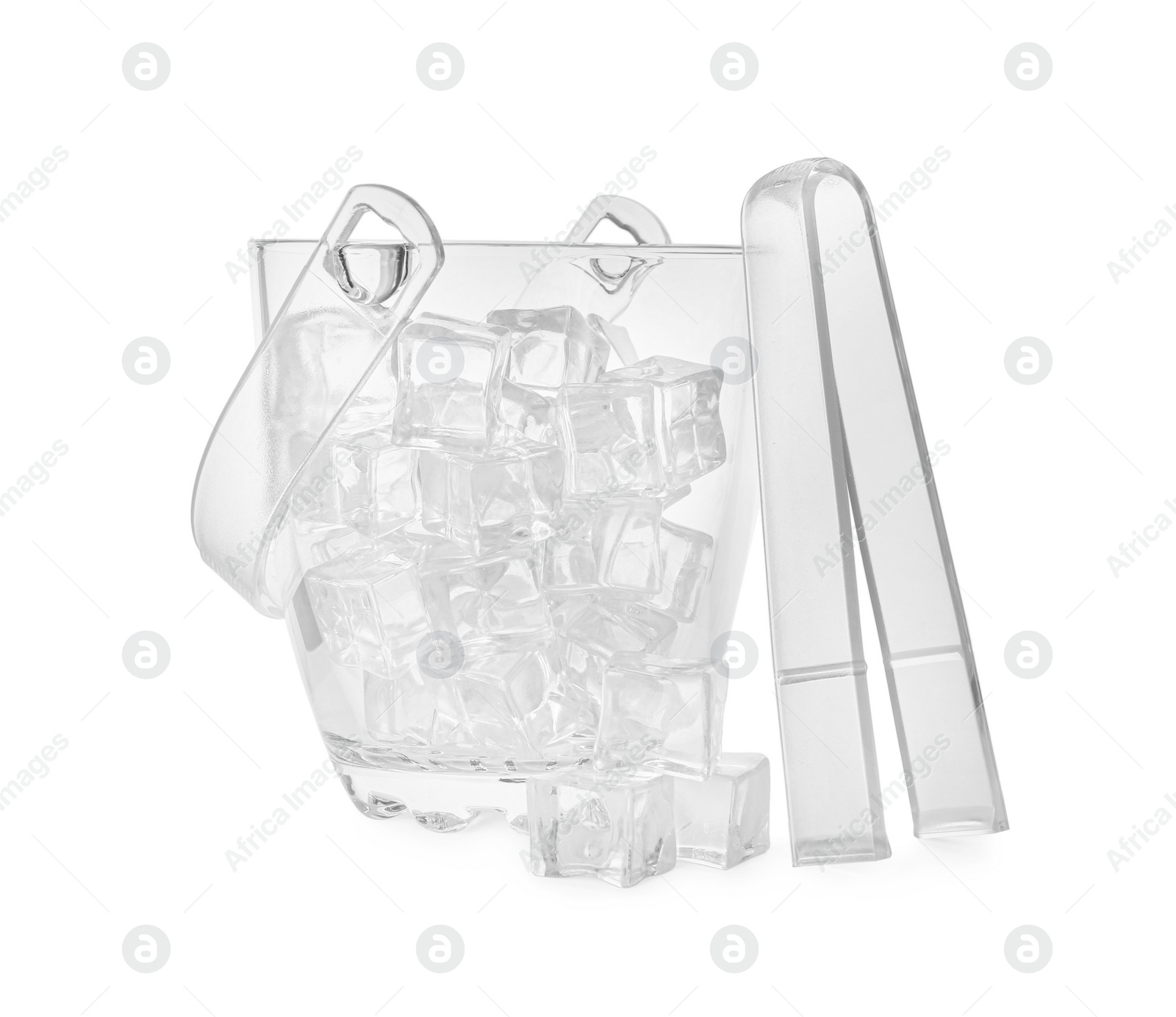 Photo of Glass bucket with ice cubes and tongs on white background