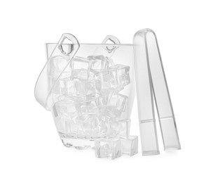 Photo of Glass bucket with ice cubes and tongs on white background