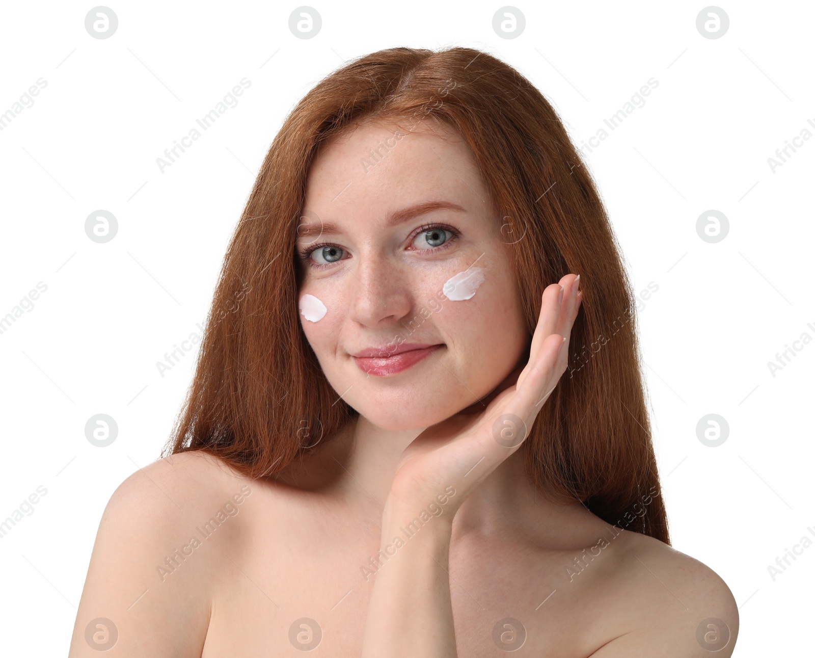 Photo of Beautiful woman with freckles and cream on her face against white background