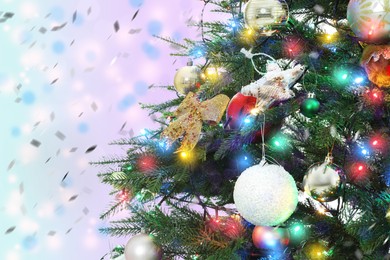 Image of Beautiful Christmas tree with bright baubles against blurred background, closeup. Space for text