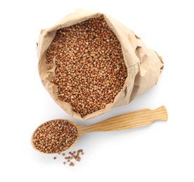 Photo of Paper bag and spoon with raw buckwheat on white background. Healthy grains and cereals