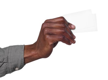 Photo of African American man holding paper cards on white background, closeup. Mockup for design