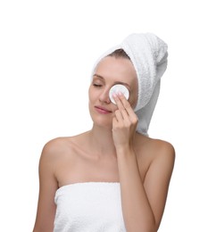 Photo of Young woman cleaning her face with cotton pad on white background