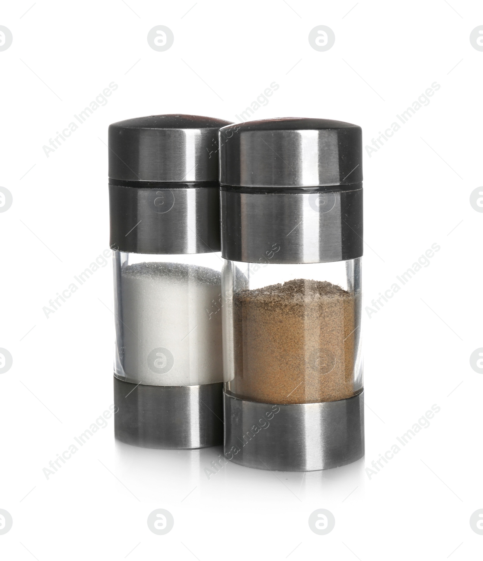 Photo of Salt and pepper shakers on white background