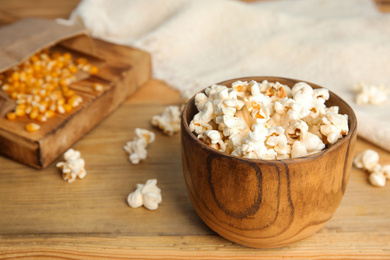 Tasty pop corn on wooden table, closeup