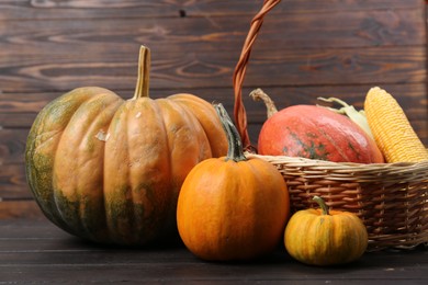 Photo of Happy Thanksgiving day. Beautiful composition with pumpkins on wooden table