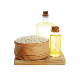 Photo of Fresh sesame oil and seeds isolated on white