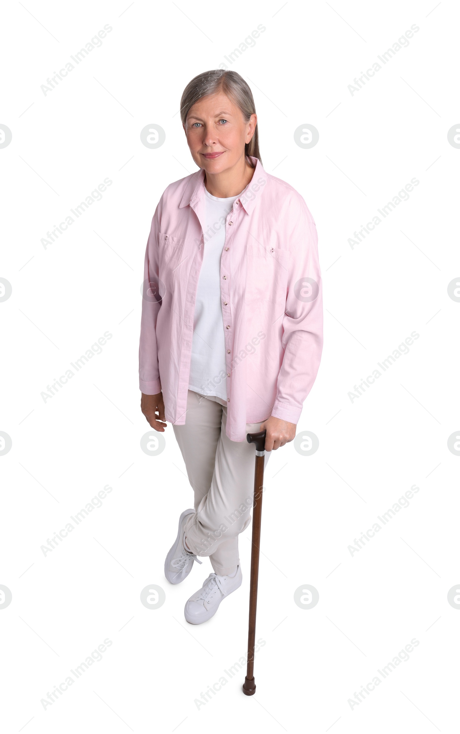 Photo of Senior woman with walking cane on white background, above view