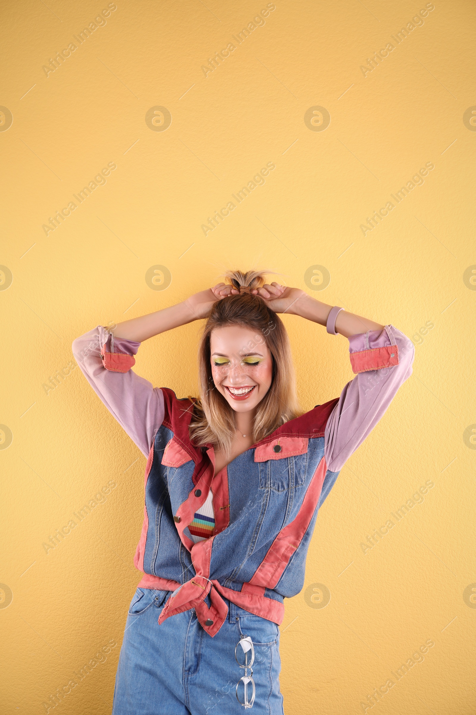 Photo of Beautiful young woman posing on color background. Summer fashion