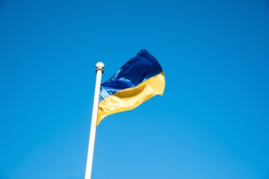 Photo of National flag of Ukraine against clear blue sky