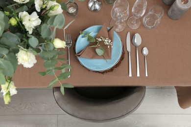 Photo of Festive table setting with beautiful tableware and decor indoors, top view