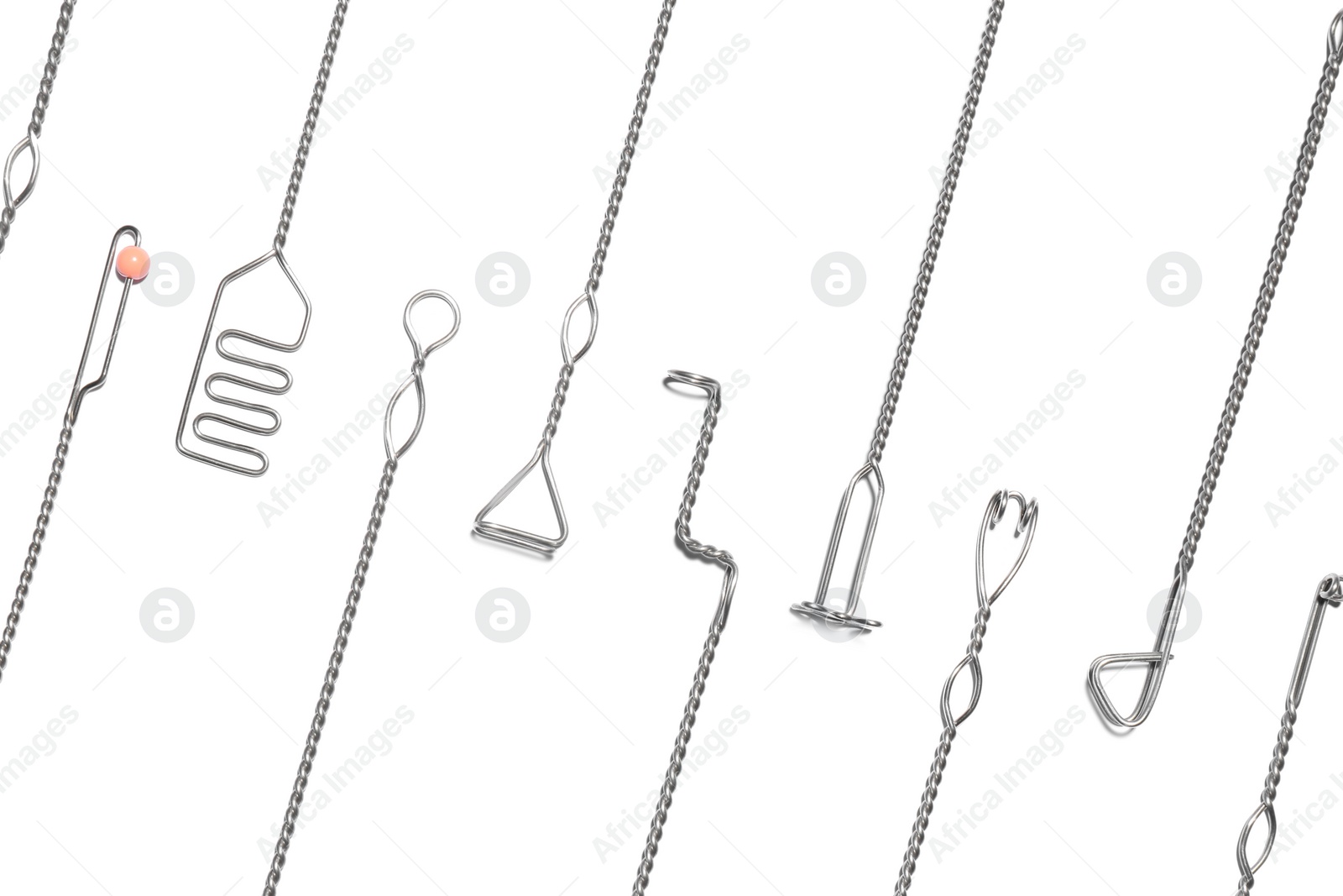 Photo of Set of logopedic probes on white background, top view. Speech therapist's tools