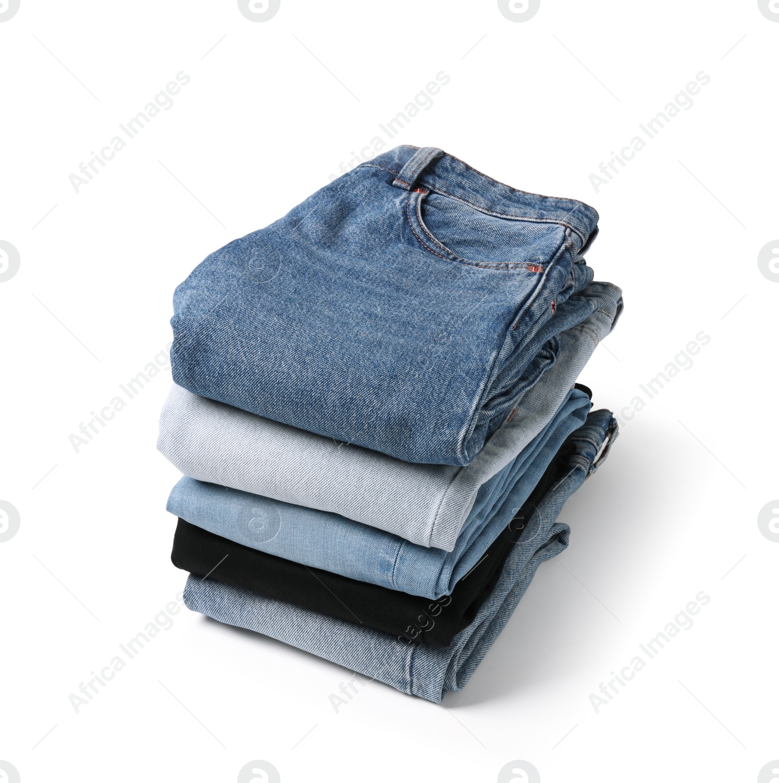 Image of Stack of different folded jeans isolated on white