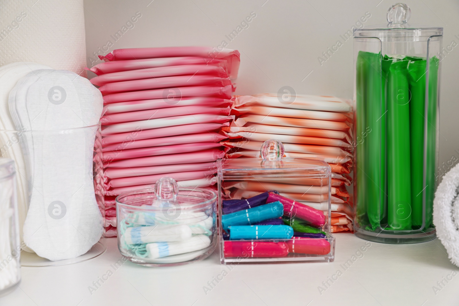 Photo of Storage of different feminine hygiene products in cabinet