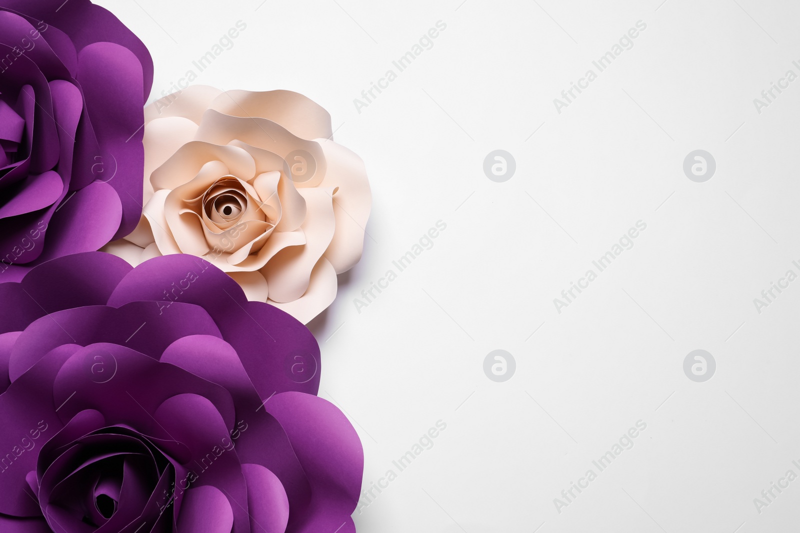 Photo of Different beautiful flowers made of paper on white background, flat lay. Space for text