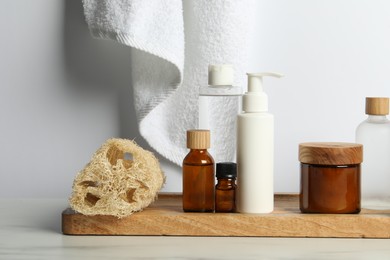 Different bath accessories and personal care products on light table