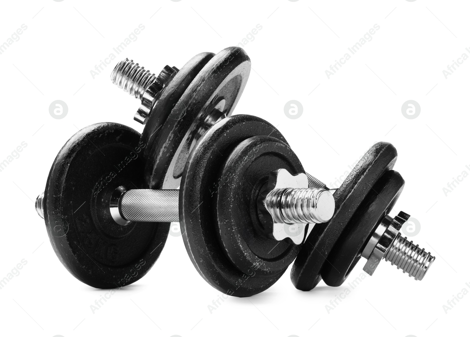 Photo of Metal dumbbells isolated on white. Sports equipment