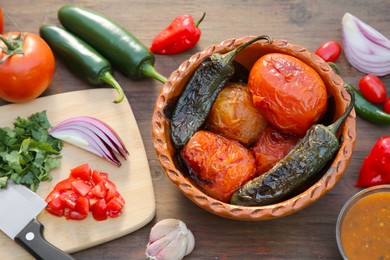 Photo of Tasty salsa sauce and ingredients on wooden table, flat lay