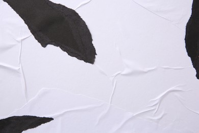 Photo of Texture of white and black ripped paper posters, closeup