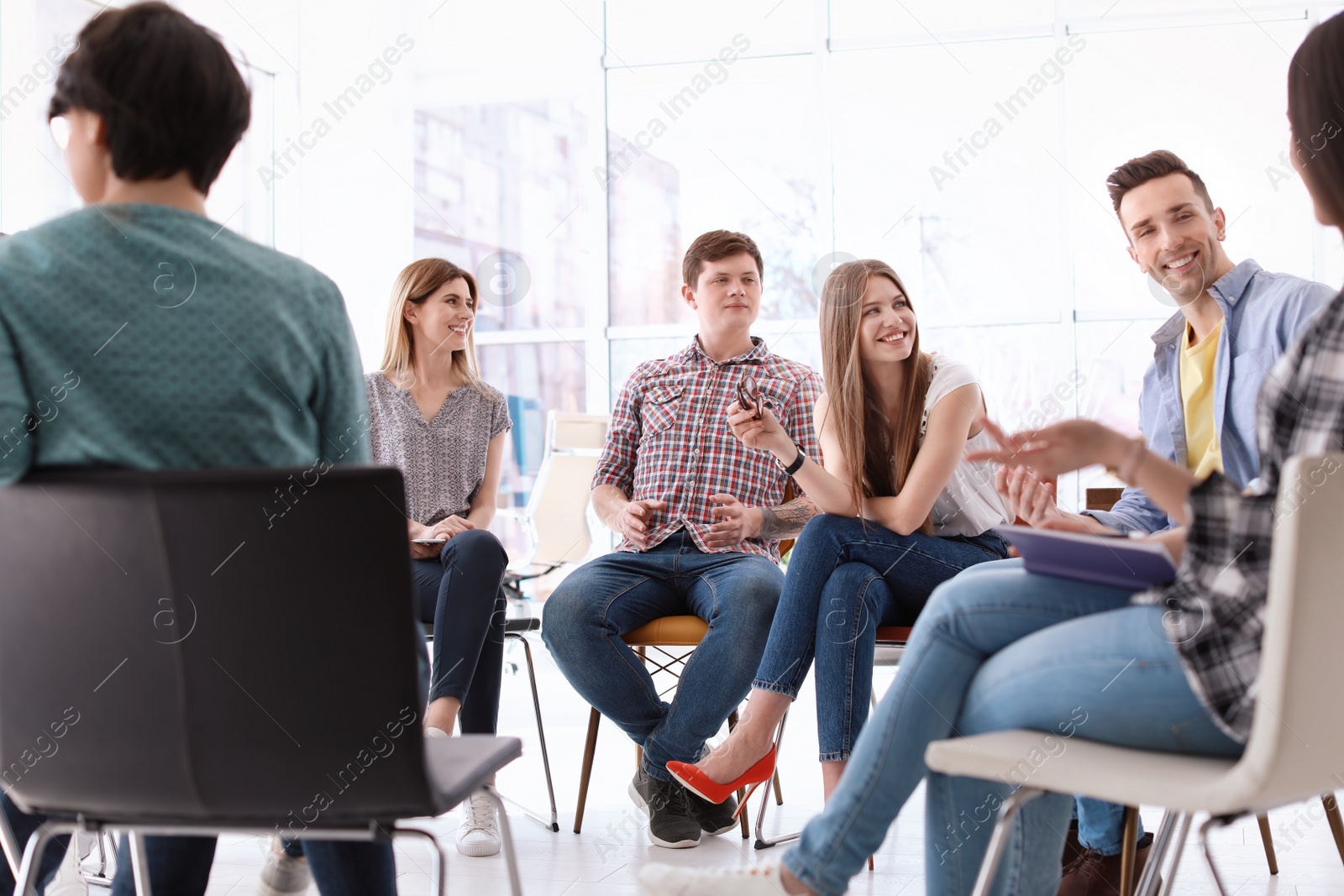 Photo of Young people having business training in office