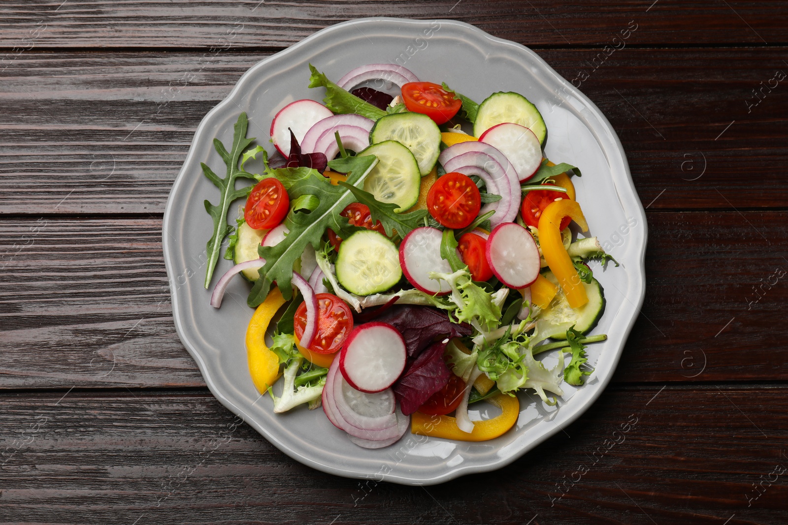 Photo of Balanced diet and vegetarian foods. Plate with different delicious products on wooden table, top view