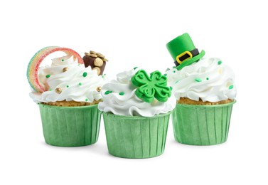 Photo of St. Patrick's day party. Tasty festively decorated cupcakes isolated on white
