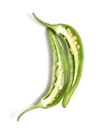 Cut green chili pepper on white background, top view