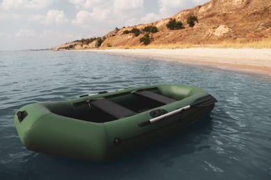 Photo of Inflatable rubber fishing boat floating in sea near coast